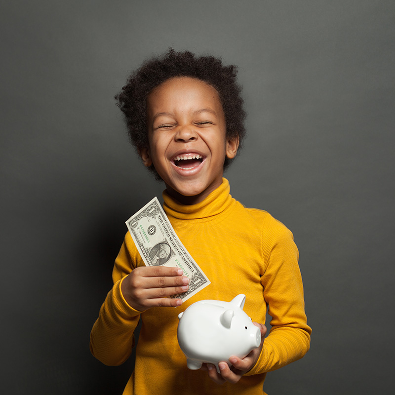 A toddler holding money