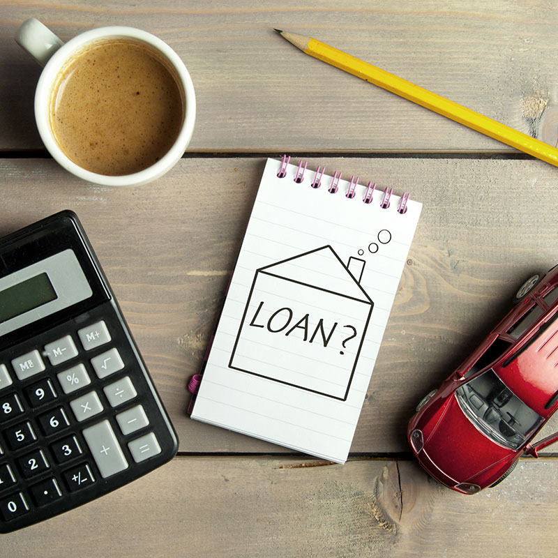 A notepad with "loan?" written on it