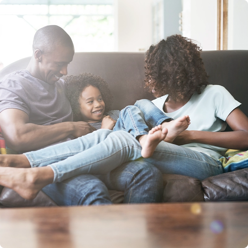 Family relaxing on sofa