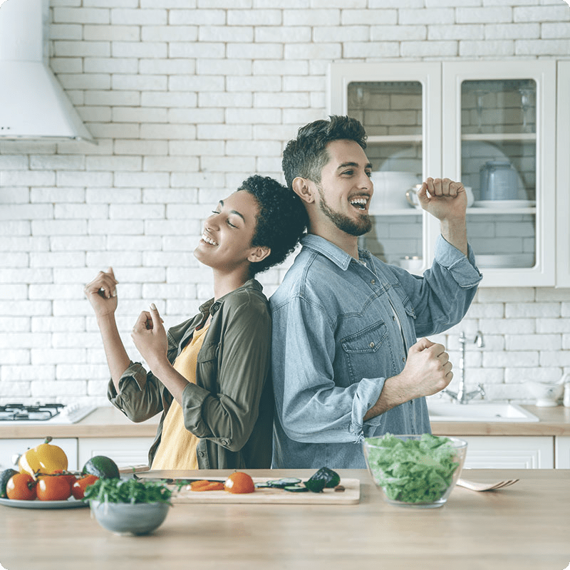 A couple dancing in the kitchen