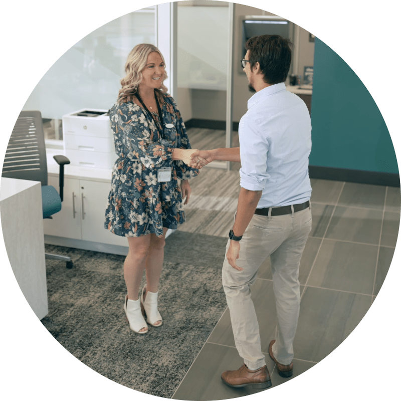 financial coach greeting member at branch